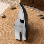 Side profile of the Peshawari Chappal Lefty's distinctive strap design
