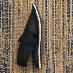 Side profile of the black Khan Chappal showing its structured build
