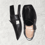 Side angle of the Black Peshawari Chappal Lapa showing its bold silhouette